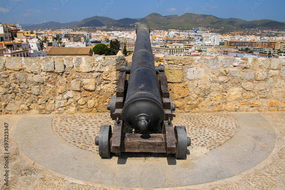 Old cannon on the fortification walls of Eivissa, the capital city of Ibiza in the Balearic Islands, Spain - Medieval citadel in the Mediterranean Sea