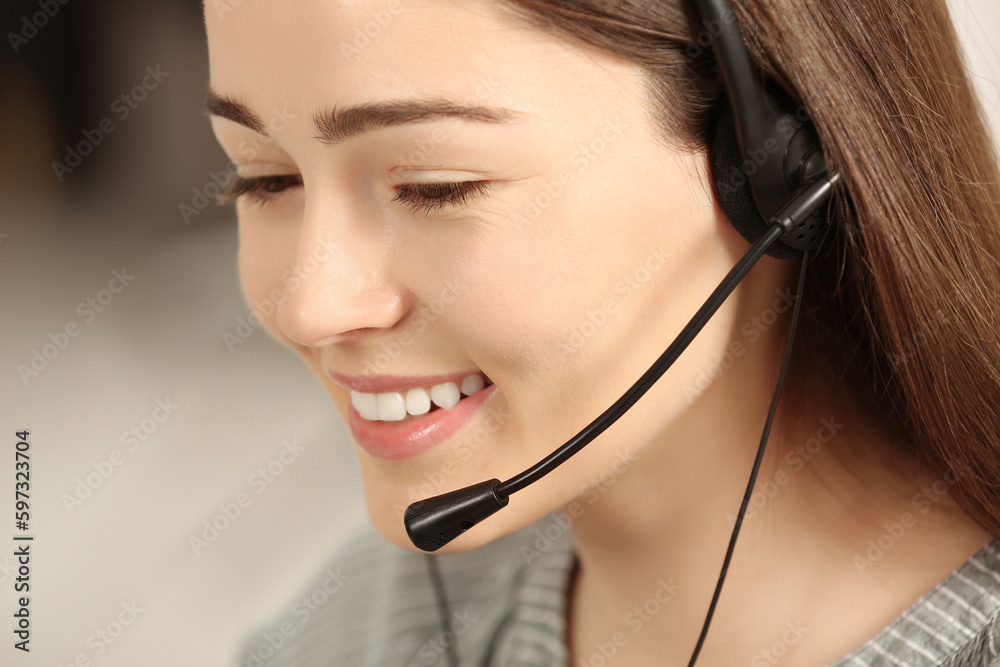 Hotline operator with headset working in office, closeup Hotline operator with headset working in office, closeup