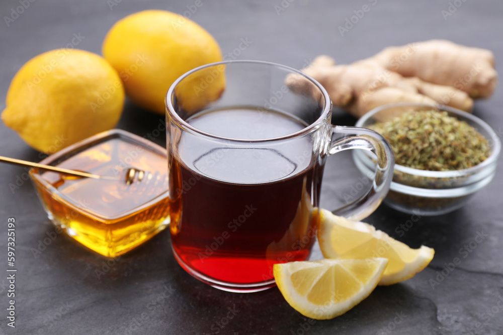 Cold remedies on black table, closeup. Cough treatment Cold remedies on black table, closeup. Cough treatment