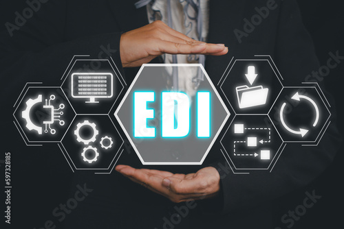EDI, Electronic data interchange concept, Person hand holding Electronic data interchange icon on virtual screen. photo