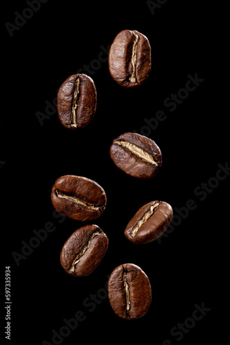 Roasted coffee beans from Colombia suspended in the air, Arabica variety.