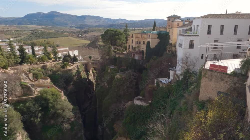 Overview of Ronda Valley with Puente Viejo in the distance, breathtaking canyon landscape, Spain Overview of Ronda Valley with Puente Viejo in the distance, breathtaking canyon landscape, Spain