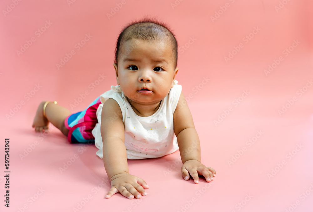 Asian baby 6 month old on pink background Asian baby 6 month old on pink background
