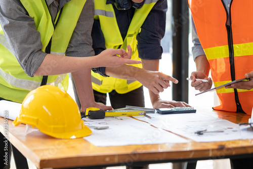 Young engineer architect sketching drawing project plan building construction, closed up cooperation corporate achievement planning design draw technology