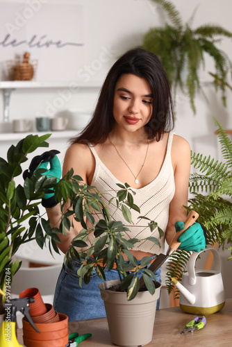 Young woman transplanting g...