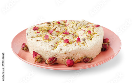 Plate of tasty Tahini halva with pistachios on white background