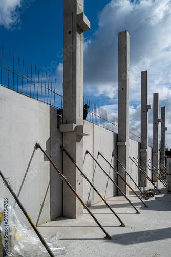 on a construction site concrete walls are supported with turnstiles