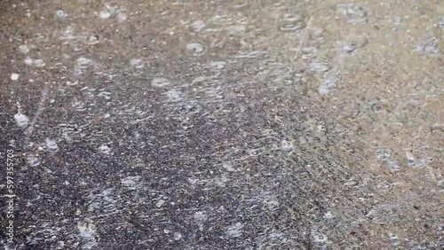 Heavy Rain Hitting pavement during Thunderstorm