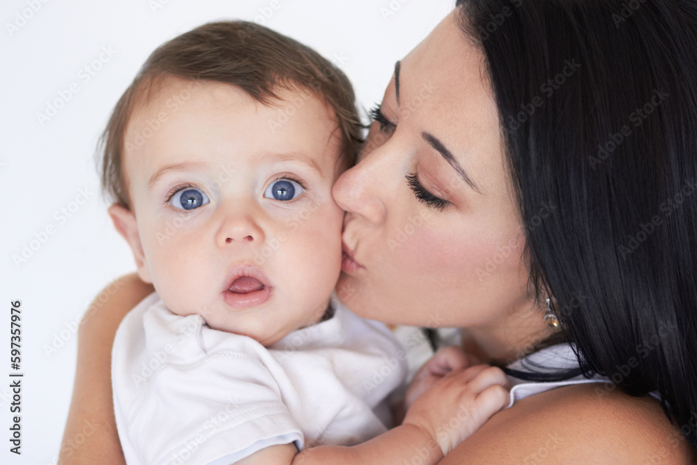 Happy, kiss and care with mother with baby for bonding, affectionate and growth. Happiness, love and family with face of woman and kissing young child on cheek for cute, sweet and kindness Happy, kiss and care with mother with baby for bonding, affectionate and growth. Happiness, love and family with face of woman and kissing young child on cheek for cute, sweet and kindness