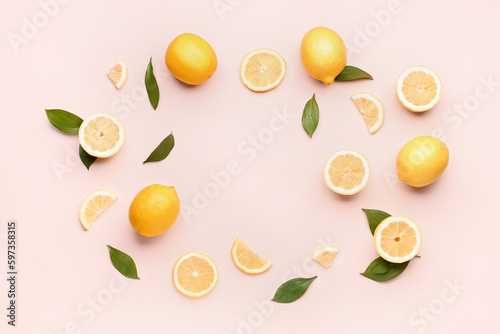 Fototapeta Naklejka Na Ścianę i Meble -  Frame made of fresh lemons on pink background