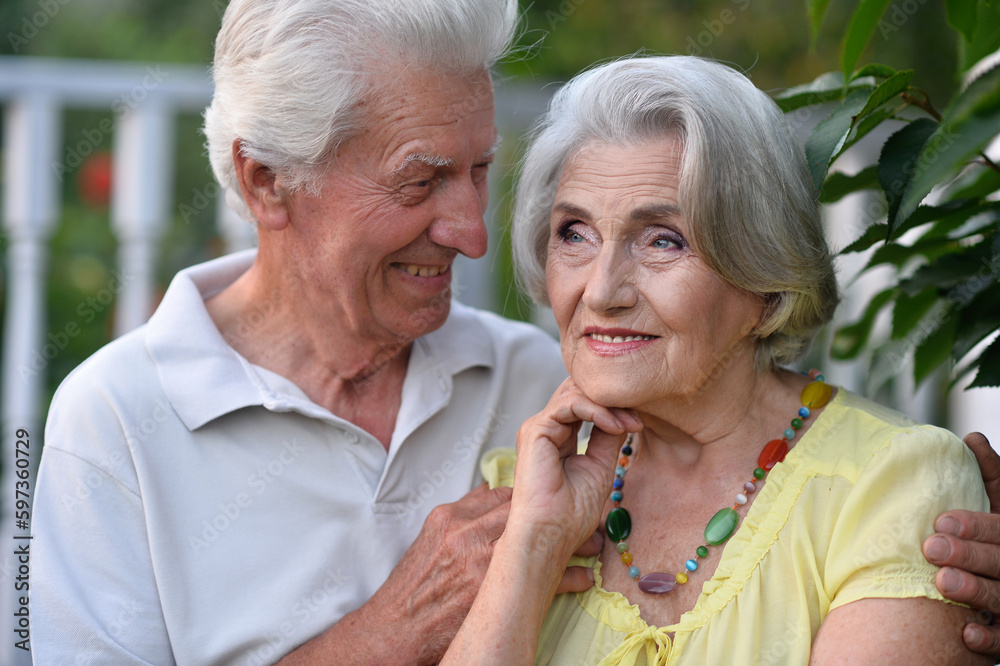 elderly couple walks in nature in summer elderly couple walks in nature in summer