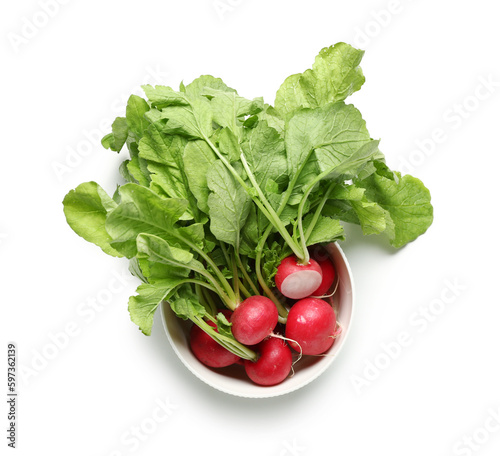 Bowl of ripe radish with green leaves isolated on white background
