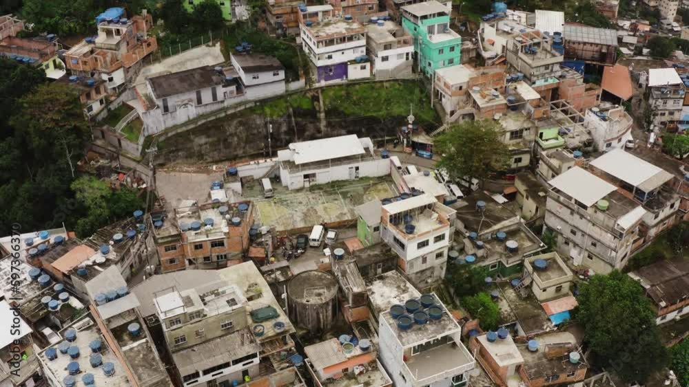 Drone top view of poor neighborhood favela in Rio de Janeiro with old destroyed soccer field Drone top view of poor neighborhood favela in Rio de Janeiro with old destroyed soccer field