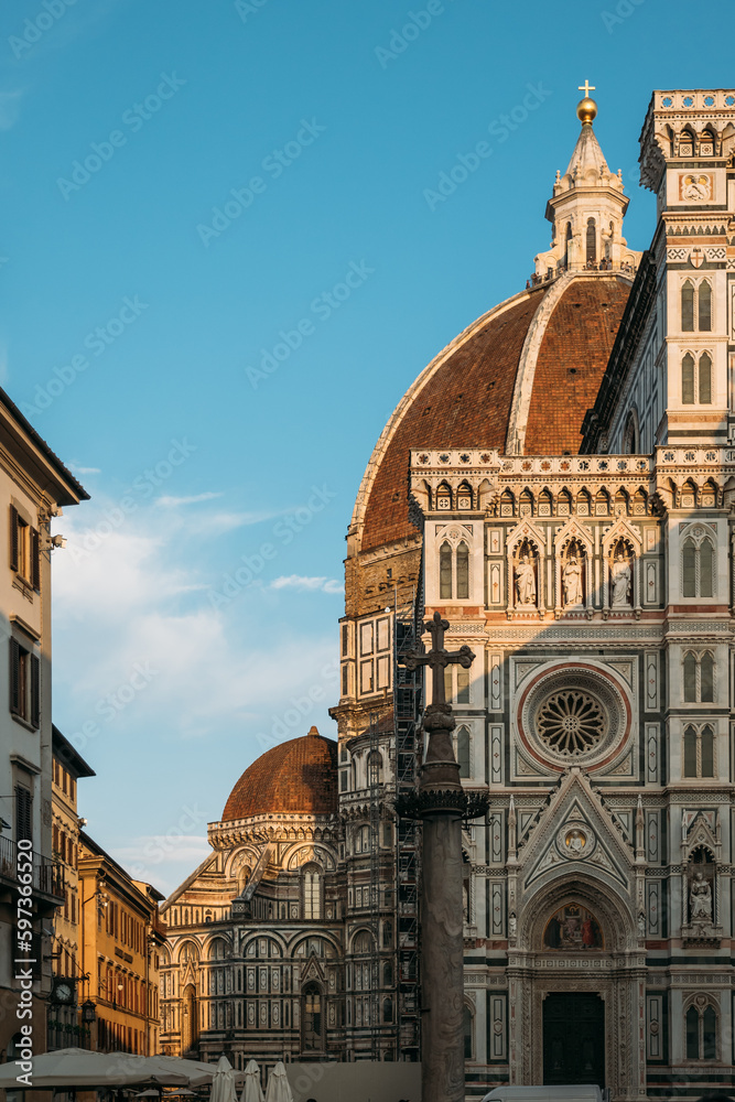 Historical landmark of Italy is the amazing Florence Cathedral of St. Mary of the Flower with a complex ornament and composition on a sunny summer evening. Concept of medieval architecture in Europe