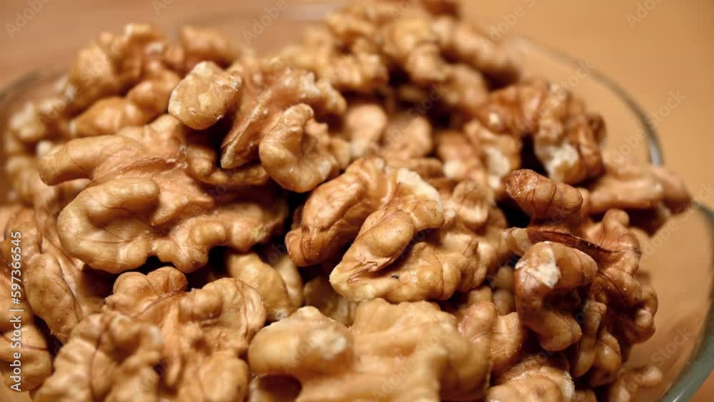 closeup of a bowl of walnuts on table, rotation closeup of a bowl of walnuts on table, rotation