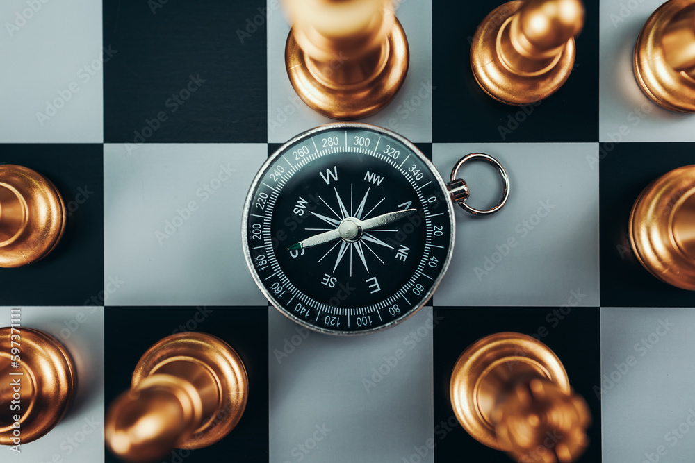 compass and chess piece on chess board game for ideas, challenge,  leadership, strategy, business, success or abstract - Stock Image -  Everypixel