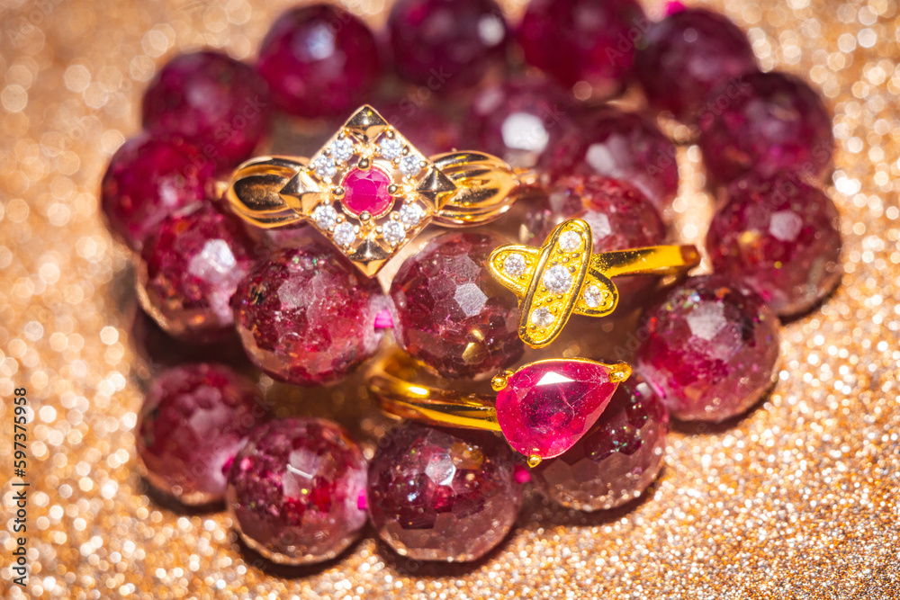 Gold ring and ruby beaded bracelet Gold ring and ruby beaded bracelet