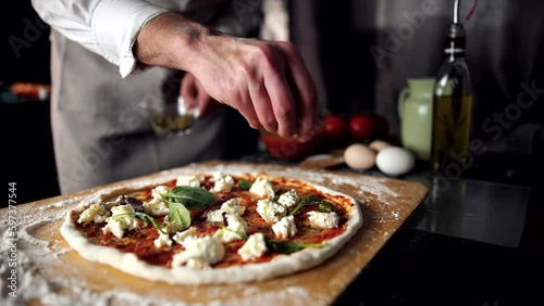 Pizzaiolo chef cooking Italian pizza making