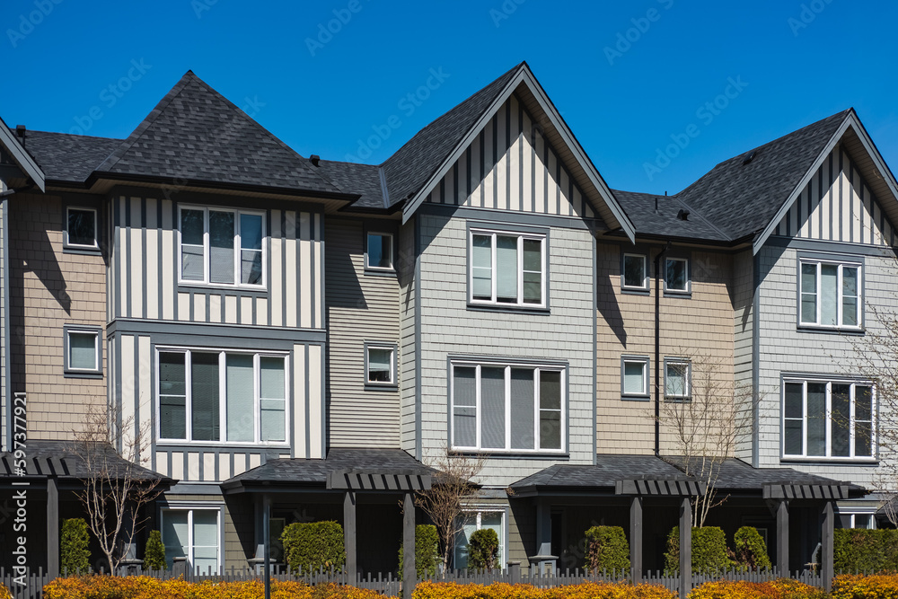 Perfect neighborhood. Houses in suburb at Spring in the north America. Real Estate Exterior Front Houses on a sunny day