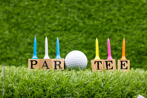 Golf party with golf ball and tee on green grass for golfer party invitation 