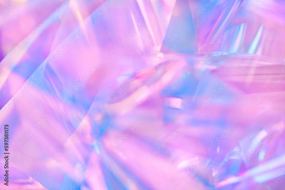 Close-up of ethereal pastel neon pink, purple, lavender, mint holographic metallic foil background. Abstract modern curved blurred surreal futuristic disco, rave, techno, festive dreamlike backdrop Close-up of ethereal pastel neon pink, purple, lavender, mint holographic metallic foil background. Abstract modern curved blurred surreal futuristic disco, rave, techno, festive dreamlike backdrop