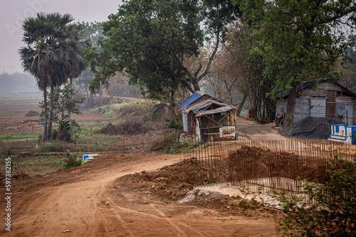Dirt road of a rural village. Summer Landscape. Rural India. Bankura West Bengal India South Asia Pacific © SB Stock
