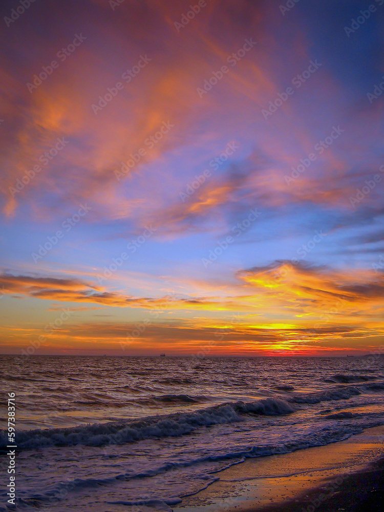 Sunset on the sea horizon in summer with a beautiful colorful sky
