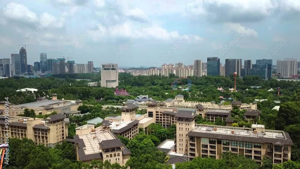 Aerial revealing shot of the Guangzhou skyline near the Chimelong Water Park in Guangzhou, China Aerial revealing shot of the Guangzhou skyline near the Chimelong Water Park in Guangzhou, China