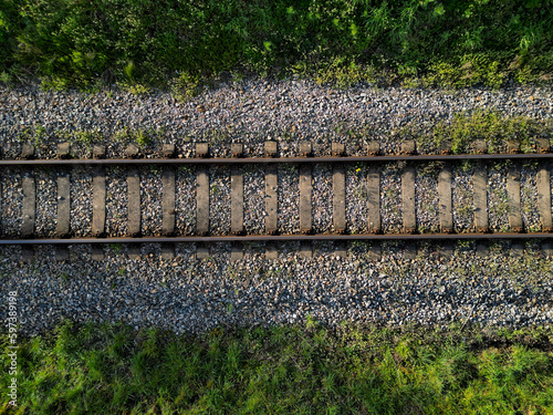 fly over train tracks in the countryside. vertical view of the landscape. background, texture modellers, transport journalists theme. background from above video photo