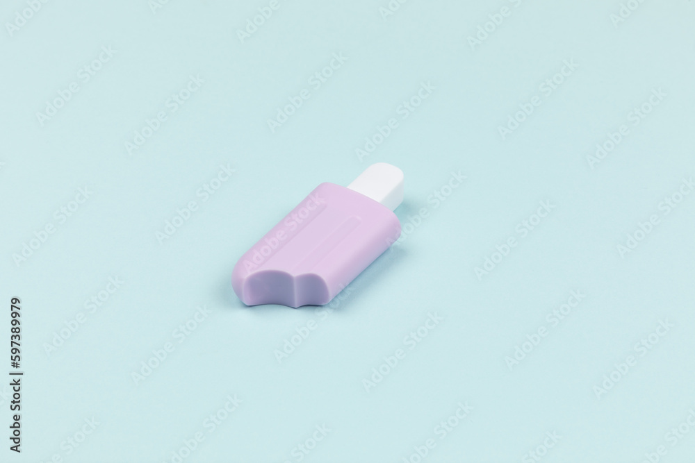 closeup of a popsicle on cyan surface icecream closeup of a popsicle on cyan surface icecream