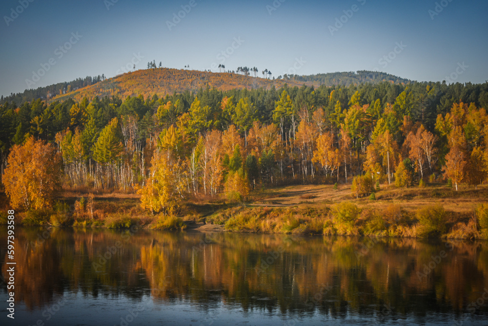 photo of the autumn forest, which stands on the river bank, autumn landscape, photo from the train window photo of the autumn forest, which stands on the river bank, autumn landscape, photo from the train window