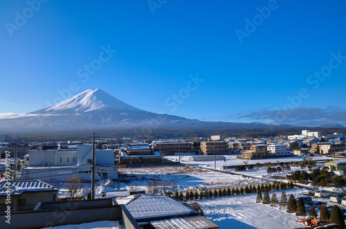 View of Mount Fuji and snow covered Fuji Kawaguchiko town, Japan in the morning time.