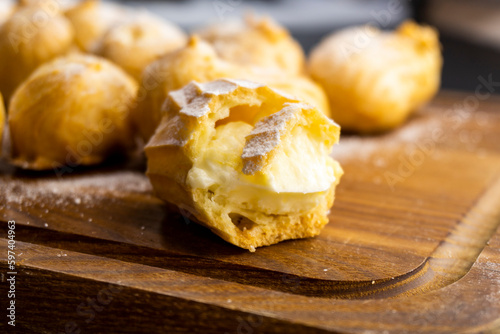 Fototapete Profiteroles on a wooden background