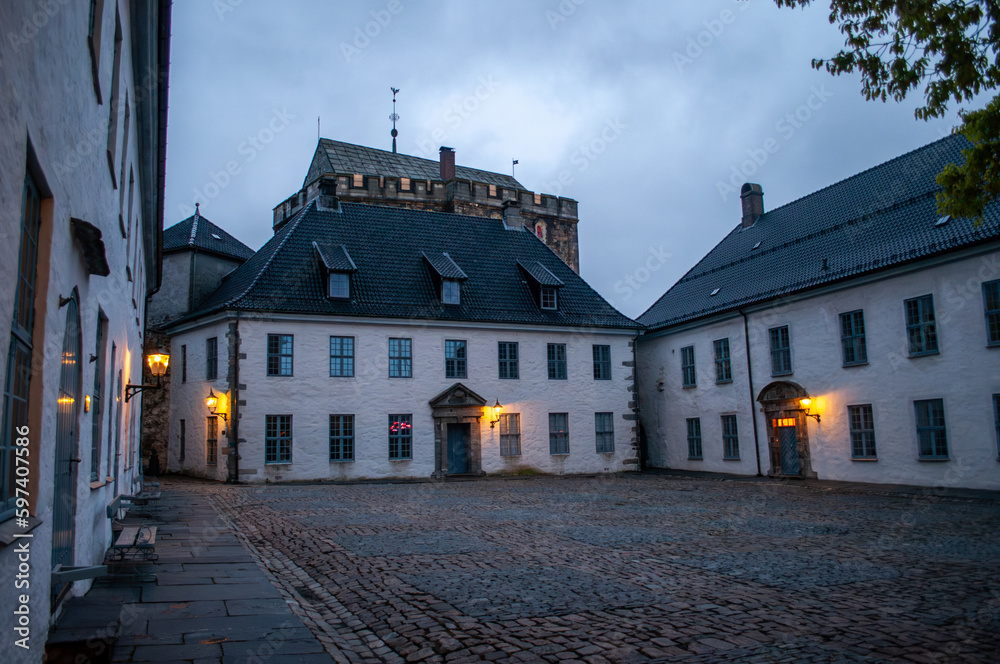 Bergenhus Fortress, Bergen, Norway - courtyard of the castle in the evening after sunset.