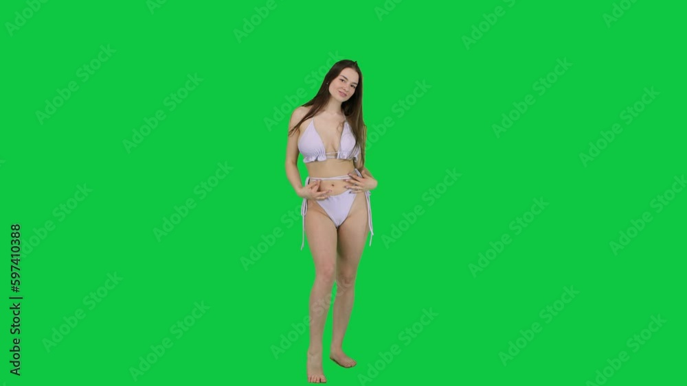 Attractive Caucasian model posing in front of a green screen Attractive Caucasian model posing in front of a green screen