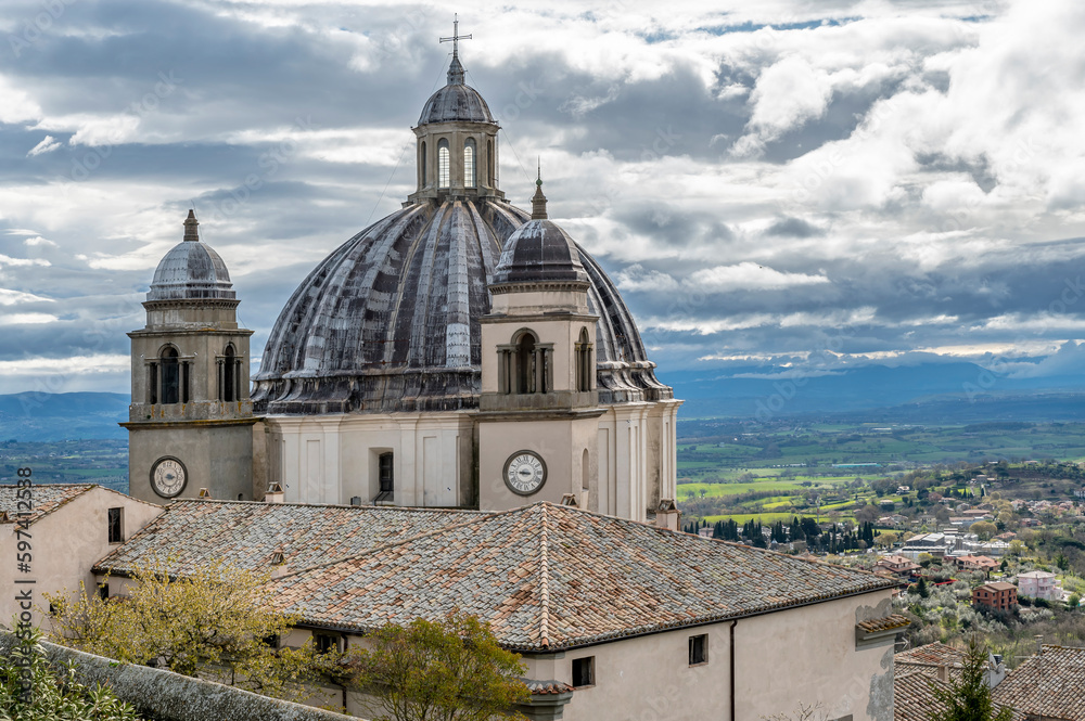 View of the dome of the Cathedral of Santa Margherita in Montefiascone, Italy, under a dramatic sky