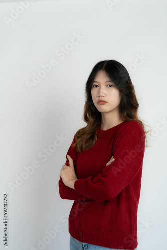 Attractive Asian beautiful woman standing on white background and doing hand gestures.