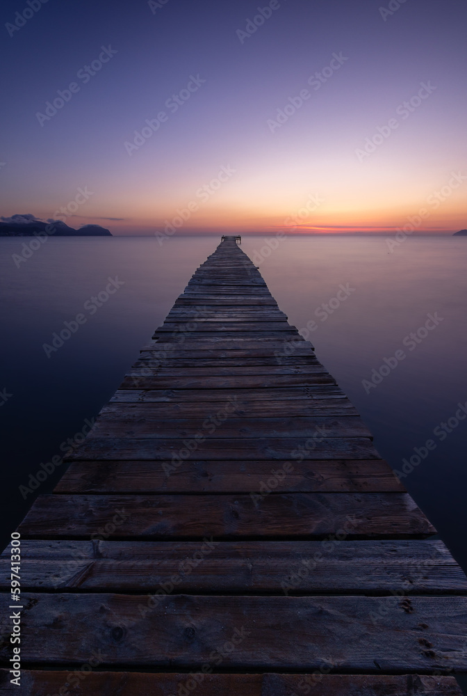 Fototapeta premium pier at the beach during sunrise/sunset