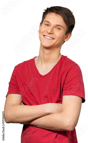 Young man smiling with his arms crossed