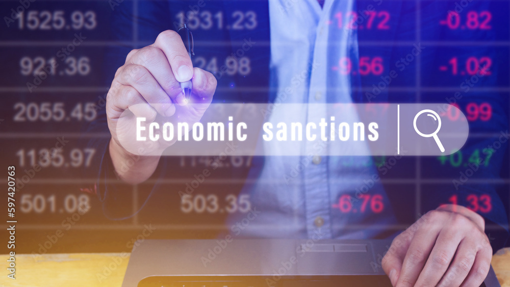 Economic sanctions, written in search bar with the financial data visible in the background. Reports Stock Market Ticker Words Economic sanctions, written in search bar with the financial data visible in the background. Reports Stock Market Ticker Words
