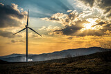 Wind turbines at beautiful orange sunset