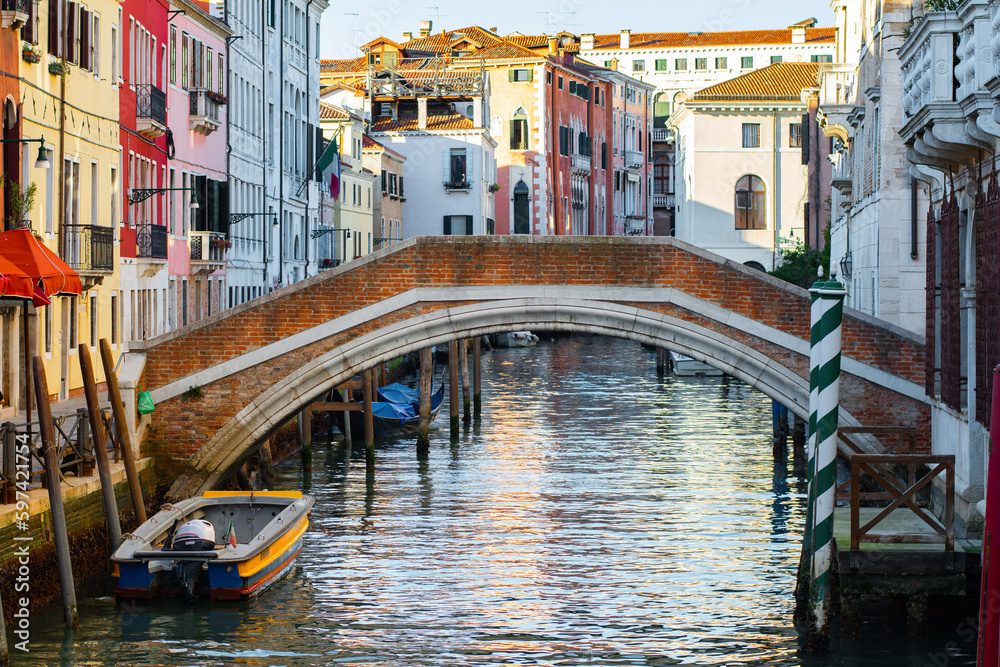 Narrow canals of Venice city with old traditional architecture, bridges and boats, Veneto, Italy. Tourism concept. Architecture and landmark of Venice. Cozy cityscape of Venice.