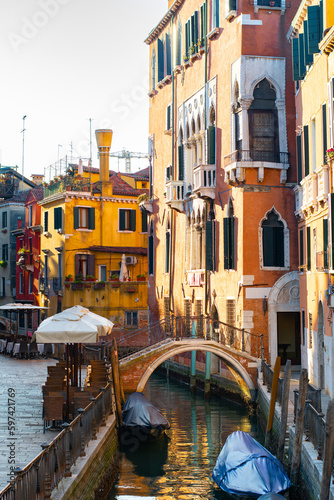 Narrow canals of Venice city with old traditional architecture, bridges and boats, Veneto, Italy. Tourism concept. Architecture and landmark of Venice. Cozy cityscape of Venice. © Lizaveta