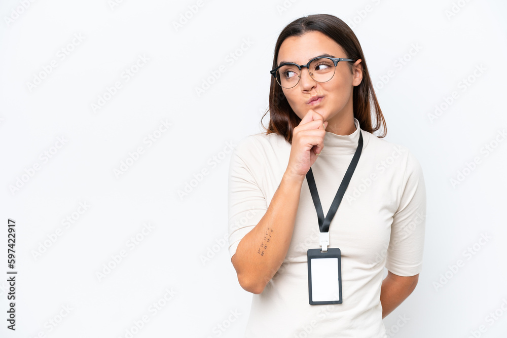 Young caucasian woman with ID card isolated on white background and looking up Young caucasian woman with ID card isolated on white background and looking up
