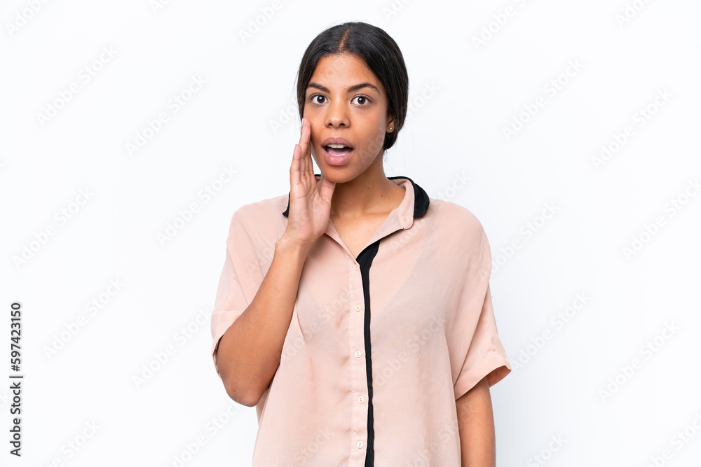 Young African american woman isolated on white background with surprise and shocked facial expression Young African american woman isolated on white background with surprise and shocked facial expression