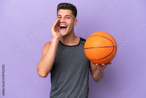 young caucasian woman basketball player man isolated on purple background shouting with mouth wide open