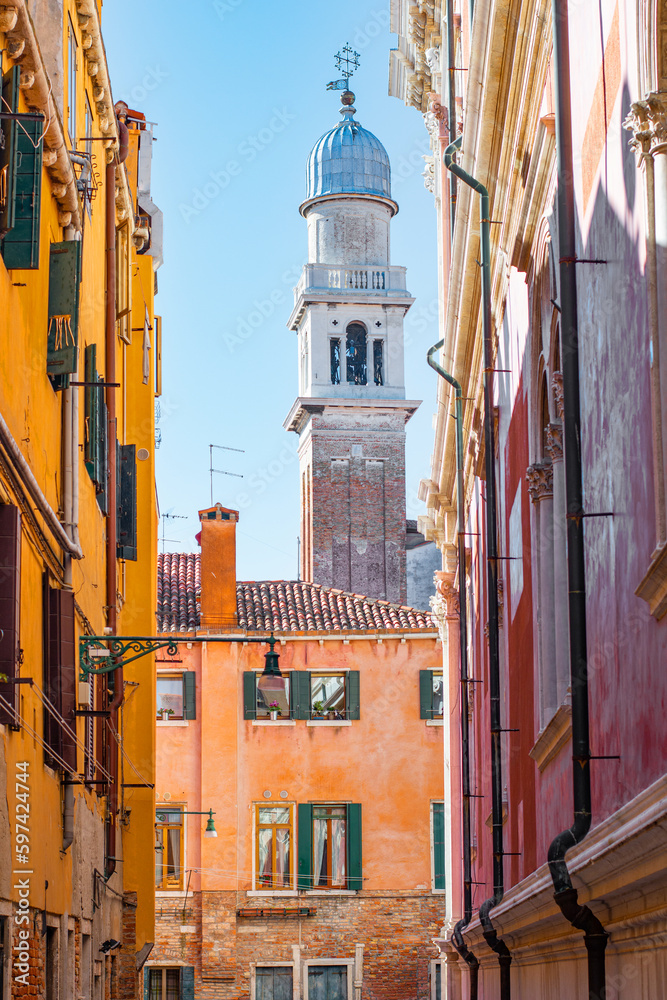Cozy narrow streets of Venice city with old traditional architecture, Veneto, Italy. Tourism concept. Architecture and landmark of Venice. Cityscape of Venice.