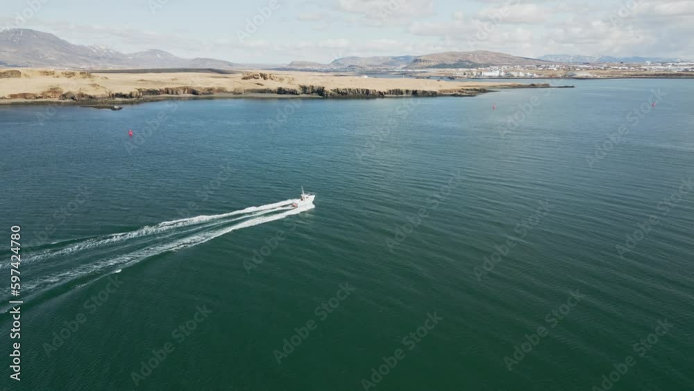 Coastal guard navigating through the fjords towards Reykjavik
