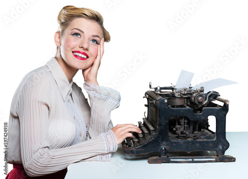 Fotografie Retro woman working in office with vintage typewriter and phone, dressed in pin-