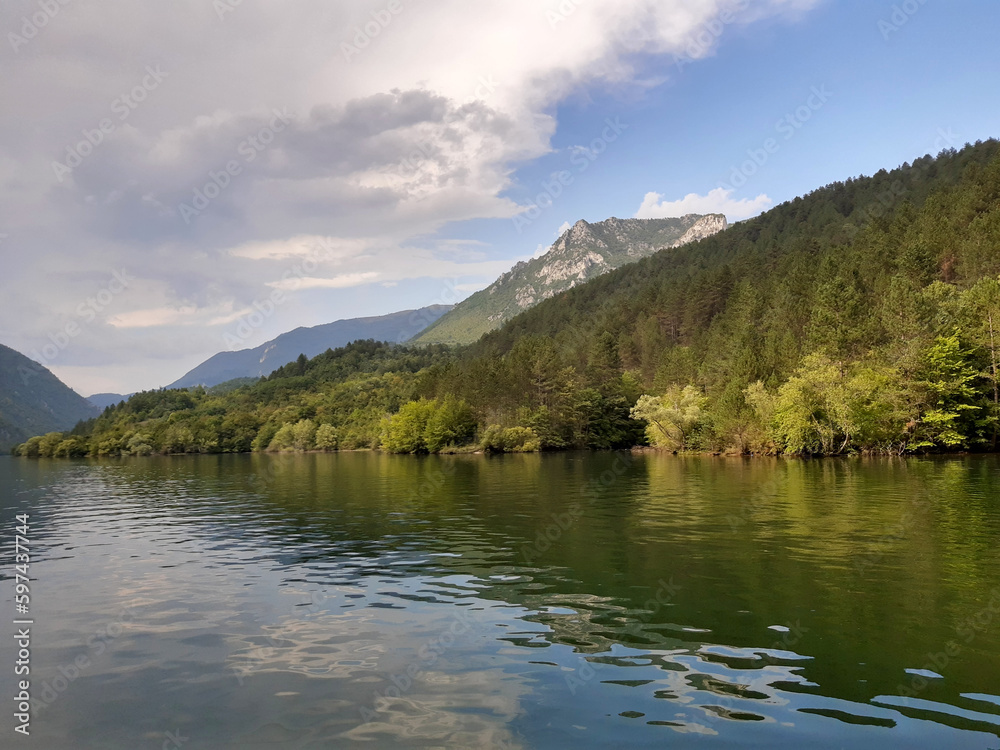 banks of river Drina with cloudy sky